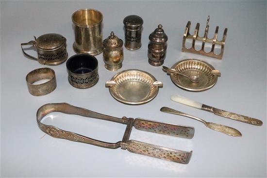 A group of silver items including asparagus tongs, condiments toastrack and Portuguese small vase